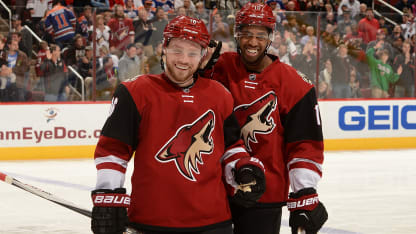 Max Domi #16 of the Arizona Coyotes and teammate Anthony Duclair