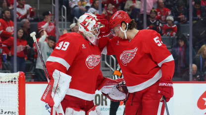 Cam Talbot #39 of the Detroit Red Wings celebrates a 5-3 win over the Chicago Blackhawks with Moritz Seider #53 at Little Caesars Arena on January 10, 2025 in Detroit, Michigan. (Photo by Gregory Shamus/Getty Images)