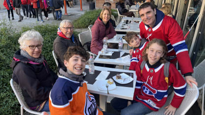 Fans in Oilers Canadiens jerseys in Milan