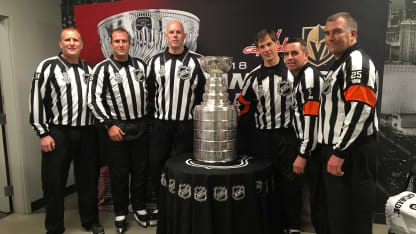 Referee crew with the Stanley Cup