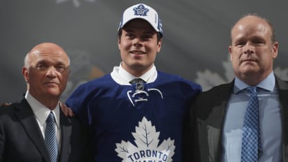 Auston Matthews poses onstage with general manager Lou Lamoriello, left, and director of player personnel Mark Hunter of the Toronto Maple Leafs after being selected first overall by the Toronto Maple Leafs in the 2016 NHL Draft at First Niagara Center on June 24, 2016 in Buffalo, New York. (Photo by Dave Sandford/NHLI via Getty Images)
