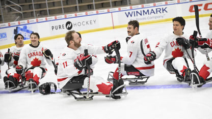 Adam Dixon sled hockey teammates