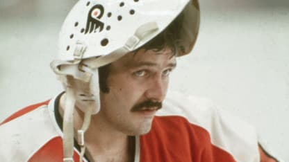 1970s: Canadian professional goalie Bernie Parent of the Philadephia Flyers stands on the ice with his face mask flipped up on his head during a 1970s NHL road game. Parent played for the Flyers from 1967-71, then returniing to complete his career with the Flyers from 1973-79. (Photo by Bruce Bennett Studios via Getty Images Studios/Getty Images)