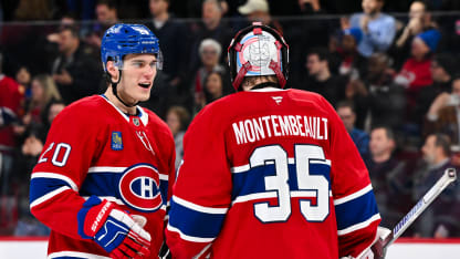 Juraj Slafkovsky #20 of the Montreal Canadiens and goaltender Sam Montembeault #35 celebrate a victory against the Tampa Bay Lightning at the Bell Centre on January 21, 2025 in Montreal, Quebec, Canada. The Montreal Canadiens defeated the Tampa Bay Lightning 3-2. (Photo by Minas Panagiotakis/Getty Images)