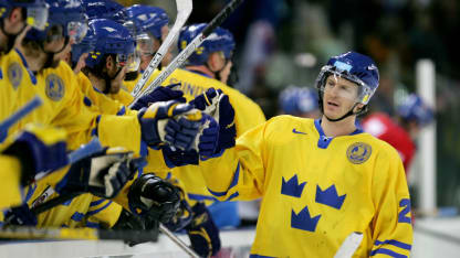 Per Johan Axelsson #22 of Sweden celebrates with his teammates after he scrored the second goal during the first period in the semi final of the men's ice hockey match between Sweden and Czech Republic during Day 14 of the Turin 2006 Winter Olympic Games on February 24, 2006 at the Palasport Olimpico in Turin, Italy. (Photo by Robert Laberge/Getty Images)