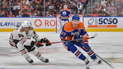 Connor McDavid #97 of the Edmonton Oilers skates against Teuvo Teravainen #86 of the Chicago Blackhawks