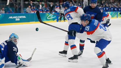 Dalibor Dvorsky #15 of Team Slovakia attempts a shot against Davide Fadani #35 of Team Italy in the second period during the Men's Preliminary Group B match between Italy and Slovakia on day seven of the Milano Cortina 2026 Winter Olympic games at Milano Rho Ice Hockey Arena on February 13, 2026 in Milan, Italy. (Photo by Elsa/Getty Images)