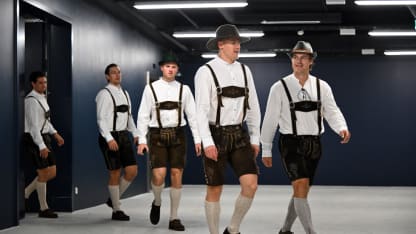 Henri Jokiharju #10 and Nicolas Aube-Kubel #96 of the Buffalo Sabres enter SAP Garden prior to the 2024 NHL Global Series Challenge