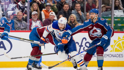 DENVER, COLORADO - MARCH 10: Leon Draisaitl #29 of the Edmonton Oilers skates between two Colorado Avalanche players during the first period of the game at Ball Arena on March 10, 2026 in Denver, Colorado. (Photo by Ashley Potts/NHLI via Getty Images)