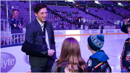 Photo of Blue Jackets talking with young fans during Hockey Fights Cancer night.