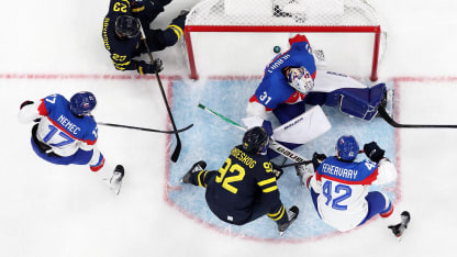 Lucas Raymond #23 of Team Sweden scores a goal past Samuel Hlavaj #31 of Team Slovakia in the third period during the Men's Preliminary Group B match between Sweden and Slovakia on day eight of the Milano Cortina 2026 Winter Olympic games at Milano Santagiulia Ice Hockey Arena on February 14, 2026 in Milan, Italy. (Photo by Jared C. Tilton/Getty Images)