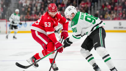 Moritz Seider #53 of the Detroit Red Wings and Mikko Rantanen #96 of the Dallas Stars fight for possession of the puck during the first period at Little Caesars Arena on December 23, 2025 in Detroit, Michigan. (Photo by Nic Antaya/Getty Images)