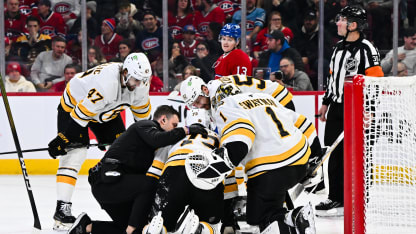 Teammates and medical staff tend to Charlie McAvoy #73 of the Boston Bruins after receiving the puck to the face during the second period against the Montréal Canadiens at the Bell Centre on November 15, 2025 in Montreal, Quebec, Canada. The Boston Bruins defeated the Montréal Canadiens 3-2. (Photo by Minas Panagiotakis/Getty Images)