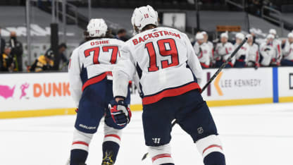 T.J. Oshie #77 and Nicklas Backstrom #19 of the Washington Capitals skate to the bench after scoring a goal in the first period against the Boston Bruins at the TD Garden on April 18, 2021 in Boston, Massachusetts. (Photo by Steve Babineau/NHLI via Getty Images)