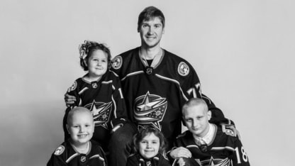 Photo of Sergei Bobrovsky posing for a photo with a group of pediatric cancer patients from Nationwide Children's Hospital.