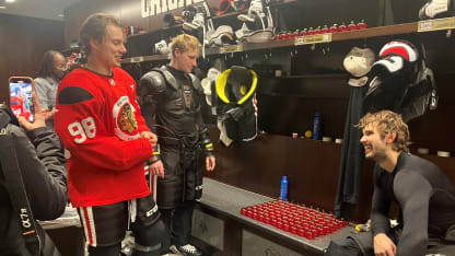 Connor Bedard 100 apples at locker for 100 assists