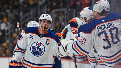 Connor McDavid #97 of the Edmonton Oilers celebrates with teammates on the bench after scoring a goal in the first period against the Pittsburgh Penguins at PPG PAINTS Arena on December 16, 2025 in Pittsburgh, Pennsylvania. (Photo by Justin Berl/Getty Images)