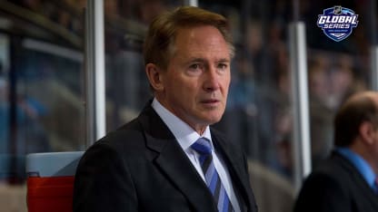 Portland Winterhawks head coach Mike Johnston stands on the bench