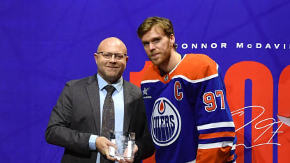Stan Bowman presents Connor McDavid #97 of the Edmonton Oilers with a Tiffany Crystal to celebrate his 1000th point prior to the game against the Columbus Blue Jackets at Rogers Place on December 5, 2024, in Edmonton, Alberta, Canada. (Photo by Andy Devlin/NHLI via Getty Images)