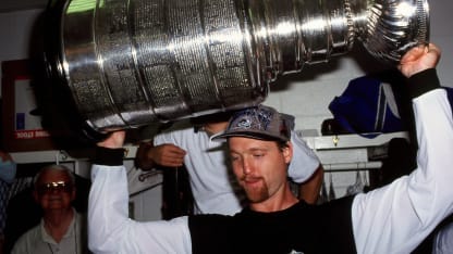 Patrick Roy #33 of the Colorado Rockies raises Stanley Cup in post game celebration after defeating the Florida Panthers . (Photo by Steve Babineau/NHLI via Getty Images)