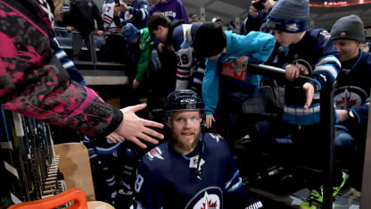 Toby Enstrom #39 of the Winnipeg Jets heads to the ice for the pre-game warm up prior to NHL action against the Vegas Golden Knights at the Bell MTS Place on February 1, 2018 in Winnipeg, Manitoba, Canada. (Photo by Darcy Finley/NHLI via Getty Images)