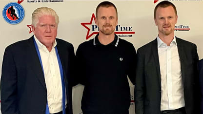 Brian Burke and the Sedins from HHOF with bug