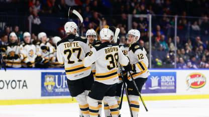 ROCHESTER, NY - APRIL 04: Providence Bruins left wing Riley Tufte (27), Providence Bruins center Patrick Brown (38), and Providence Bruins forward James Hagens (12) congratulate Providence Bruins defenseman Victor Söderström (29) after scoring a goal during the first period of the AHL game between the Providence Bruins and Rochester Americans on April 4, 2026, at Blue Cross Arena in Rochester, NY. (Photo by Jerome Davis/Icon Sportswire via Getty Images)