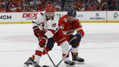 Aleksander Barkov #16 of the Florida Panthers battles for possession against Sebastian Aho #20 of the Carolina Hurricanes in Game Three of the Eastern Conference Final of the 2025 Stanley Cup Playoffs at the Amerant Bank Arena on May 24, 2025 in Sunrise, Florida. (Photo by Eliot J. Schechter/NHLI via Getty Images)