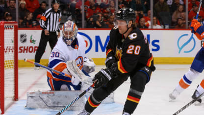 Flames overcome deficits to earn point against Islanders