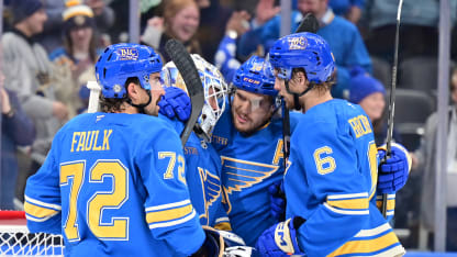 Blues players surround St. Louis Blues goaltender Jordan Binnington (50) after winning a team-record 12th straight game after a NHL game between the Colorado Avalanche and the St. Louis Blues on April 05, 2025, at Enterprise Center, St. Louis MO. (Photo by Keith Gillett/Icon Sportswire via Getty Images)