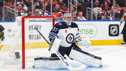 Hellebuyck gets shutout in opener