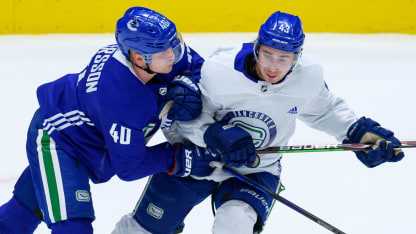 Canucks' Pettersson, Hughes miss start of training camp