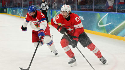 Nico Hischier #13 of Team Switzerland controls the puck against Radko Gudas #3 of Team Czechia in the third period during the Men's Preliminary Group A match between Switzerland and Czechia on day nine of the Milano Cortina 2026 Winter Olympic games at Milano Santagiulia Ice Hockey Arena on February 15, 2026 in Milan, Italy. (Photo by Bruce Bennett/Getty Images)