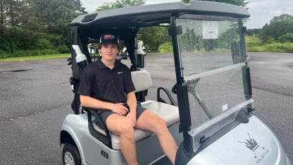 Macklin Celebrini golf cart