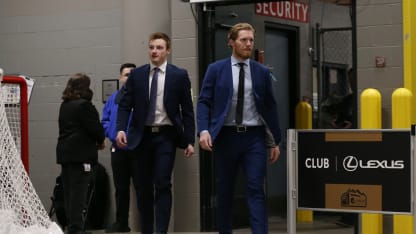 Cale Makar Game 3 Playoffs Calgary Flames pregame suit walking in Gabriel Landeskog 2019 April 15
