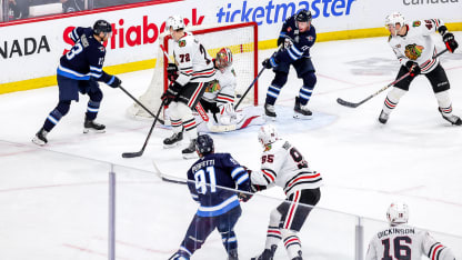 Perfetti ties it in 3rd with goal off mask