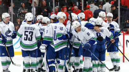 The Vancouver Canucks celebrate a win against the Calgary Flames at Scotiabank Saddledome on March 12, 2025 in Calgary, Alberta, Canada. (Photo by Gerry Thomas/NHLI via Getty Images)
