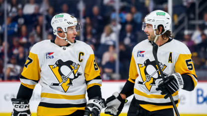 idney Crosby #87 and Kris Letang #58 of the Pittsburgh Penguins discuss strategy during a first period stoppage in play against the Winnipeg Jets at the Canada Life Centre on October 20, 2024 in Winnipeg, Manitoba, Canada. (Photo by Jonathan Kozub/NHLI via Getty Images)