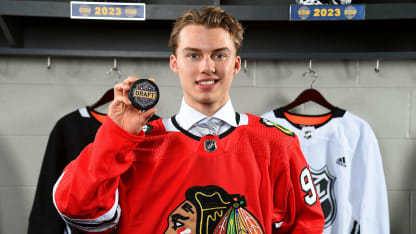 Connor Bedard draft photo holding puck