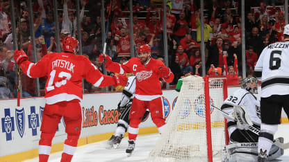 Pavel Datsyuk #13 of the Detroit Red Wings celebrates his first period goal with teammate Henrik Zetterberg #40 of the Detroit Red Wings during a NHL game against the Los Angeles Kings on October 31, 2014 at Joe Louis Arena in Detroit, Michigan. (Photo by Dave Reginek/NHLI via Getty Images)