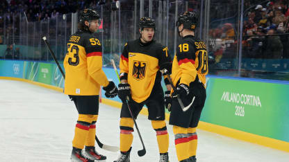 Moritz Seider #53, John Peterka #77 and Tim Stutzle #18 of Team Germany discuss in the third period during the Men's Qualification Playoff match between Germany and France on day 11 of the Milano Cortina 2026 Winter Olympic games at Milano Santagiulia Ice Hockey Arena on February 17, 2026 in Milan, Italy. (Photo by Bruce Bennett/Getty Images)