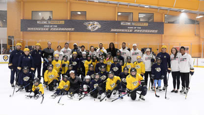 Player Inclusion Coalition on ice with kids