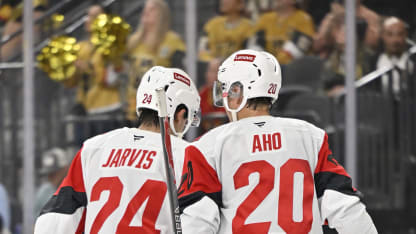 Sebastian Aho #20 of the Carolina Hurricanes talks with Seth Jarvis #24 during the third period against the Vegas Golden Knights at T-Mobile Arena on October 20, 2025 in Las Vegas, Nevada. (Photo by David Becker/NHLI via Getty Images)