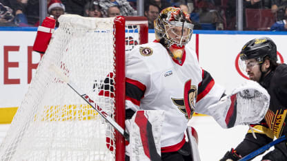 Conor Garland #8 of the Vancouver Canucks and Jacob Bernard-Docker #24 of the Ottawa Senators battle for the puck during the first period of their NHL game at Rogers Arena on December 21, 2024 in Vancouver, British Columbia, Canada. (Photo by Jeff Vinnick/NHLI via Getty Images)