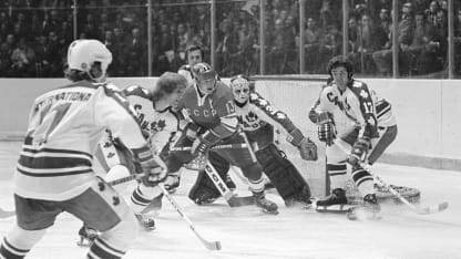 Goalie Gerry Cheevers #30 guards the goal while Rick Smith #17, Paul Schmyr #18 and Marke Hoe #11 of team Canada try to keep the puck away from Boris Mikhailov #13 of the Soviet Union during a Summit Series game September, 1974 in Montreal, Canada. (Photo by Denis Brodeur/NHLI via Getty Images)