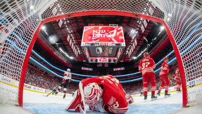 DETROIT, MICHIGAN - APRIL 11: Cody Glass #12 of the New Jersey Devils scores a goal to tie the game on John Gibson #36 of the Detroit Red Wings during the third period at Little Caesars Arena on April 11, 2026 in Detroit, Michigan. New Jersey defeated Detroit 5-3. (Photo by Dave Reginek/NHLI via Getty Images)