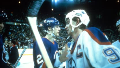 Wayne Gretzky #99 of the Edmonton Oilers shakes hands with Mike Bossy #22 of the New York Islanders after the Oilers defeated the Islanders in Game 5 of the 1984 Stanley Cup Finals on May 19, 1984 at the Northlands Coliseum in Edmonton, Alberta, Canada. (Photo by B Bennett/Getty Images)