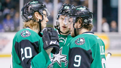 Forward Roope Hintz (left) chats with teammates Remi Elie and Denis Gurianov during a stoppage in Texas' Game 1 win over Ontario.