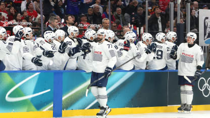 Sacha Treille #77 of Team France celebrates with teammates after scoring a goal in the third period during the Men's Preliminary Group A match between Canada and France on day nine of the Milano Cortina 2026 Winter Olympic games at Milano Santagiulia Ice Hockey Arena on February 15, 2026 in Milan, Italy. (Photo by Bruce Bennett/Getty Images)
