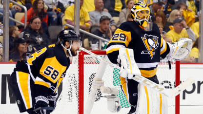 Kris Letang #58 and Marc-Andre Fleury #29